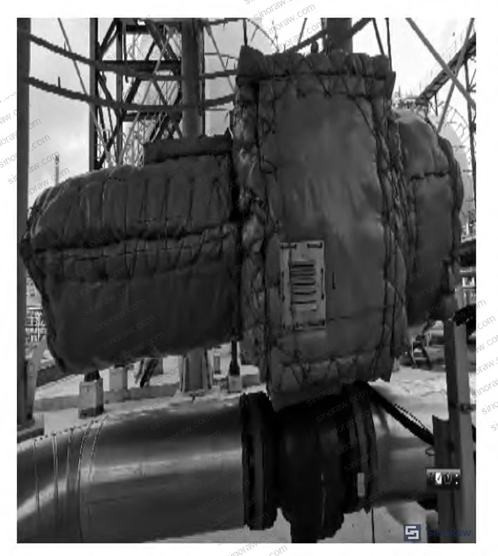 Figure 1: Flexible fire protection cover for EBV pneumatic actuators — constructed from stainless steel wire mesh, plastic weave, aluminum foil, and insulating fiber layers, stitched with stainless steel wire. Asbestos materials are prohibited.