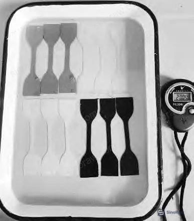Figure 1: Tensile test specimen preparation using a universal testing machine — dumbbell-type samples cut from 2 mm cured RTV sheets per GB/T 528 protocol