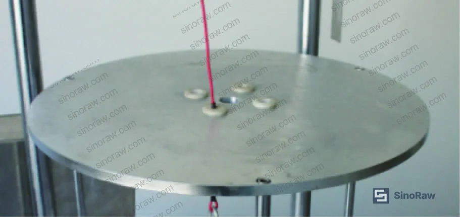 Figure 3: Adjustable conductor height mechanism showing the 125–320 mm range and the four bushing sizes accommodated by the test fixture